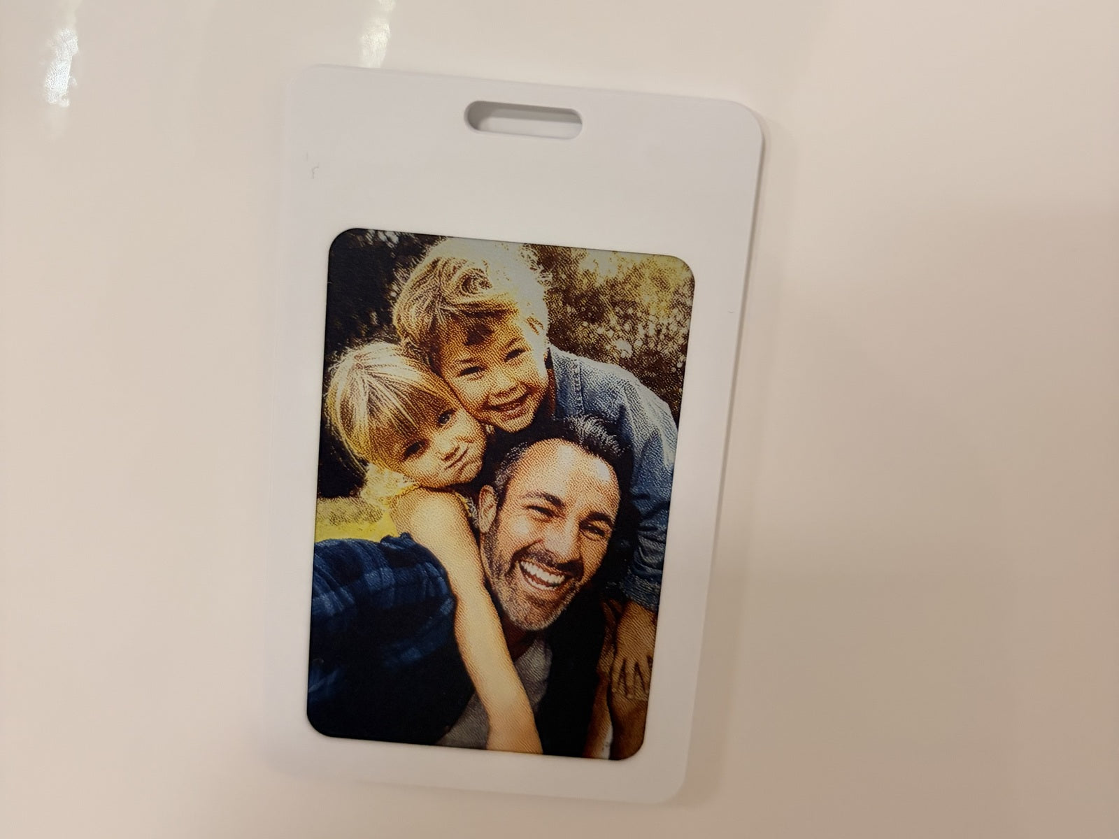 Original photo of the Loopi prototype with a colour family photo directly on a fridge surface.
